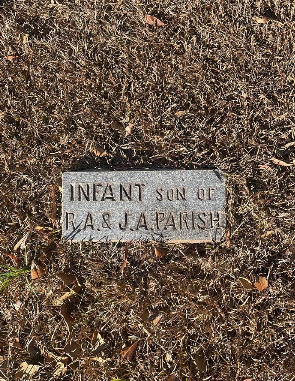 The same marker after cleaning — stone clean and the inscription legible again