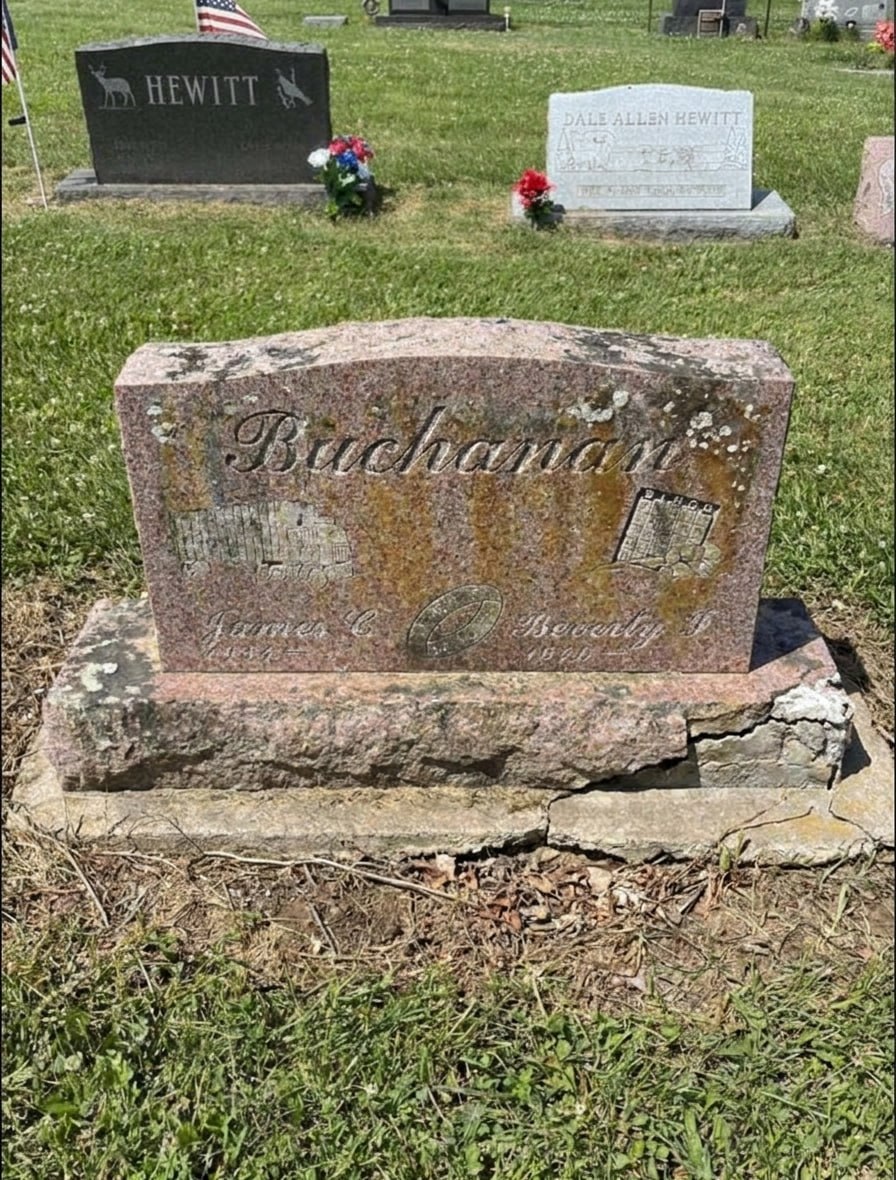 A Buchanan family headstone with a cracked, broken base and heavy staining